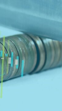 Vertical video: Coin stack sitting on desk as metal bar settling making finance bars covering coins