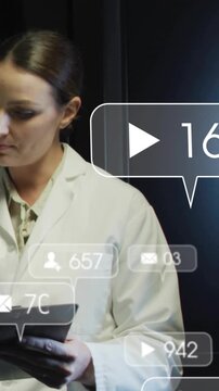 Vertical video: Lab tech holding tablet, social bubbles appearing, counts changing, checking counts