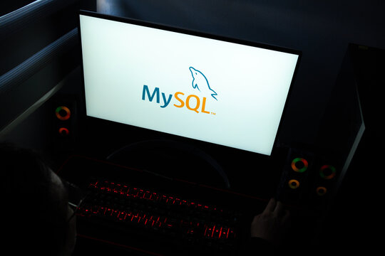 Punta Arenas, Chile &ndash; March 29, 2026: A desktop computer monitor in a dark room displaying the MySQL logo, representing the popular open-source relational database management system (RDBMS)