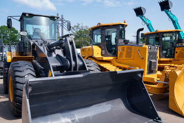 Row of brand new tractors and bulldozers for sale © scharfsinn86