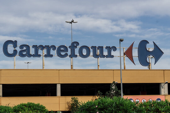 Barcelona, Spain - May 16, 2021. Logo and facade of Carrefour, a multinational distribution chain of French origin