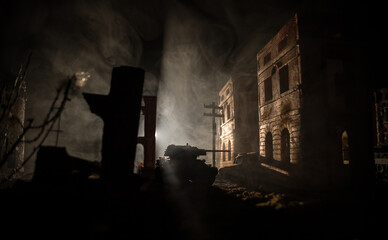 Fototapeta premium War Concept. Military silhouettes fighting scene on war fog sky background, World War Soldiers Silhouette Below Cloudy Skyline At night. Battle in ruined city.