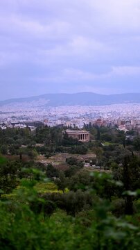 View of the Temple of Hephaestus at the city of Athens. Vertical footage, rack focus transition.