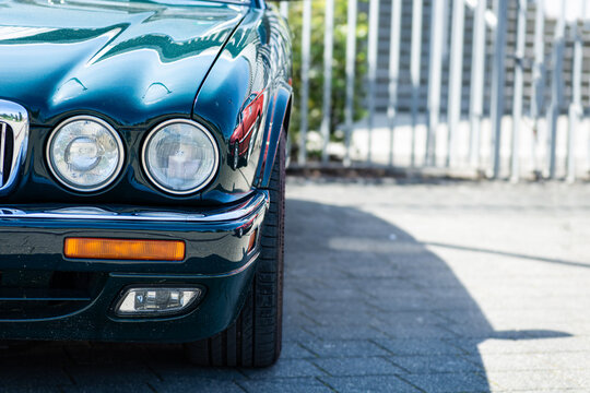 Close-up of vintage classic oldtimer car headlight with chrome details, copy space