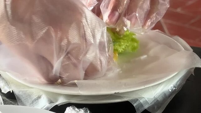 Making a Vietnamese Rice Paper Roll with Grilled Fish and Vegetable