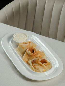 Pancakes and yogurt on plate