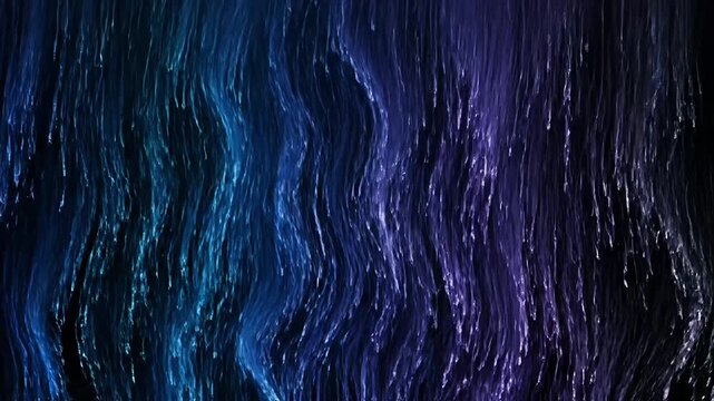 shimmering blue and purple tinsel curtain on black background