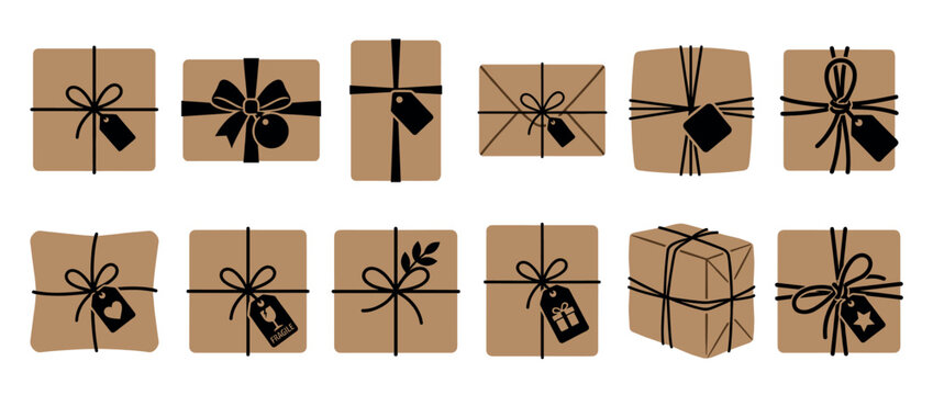 Collection of various brown gift boxes and packages wrapped with black string and decorative tags, perfect for holidays, shipping, or special occasions.