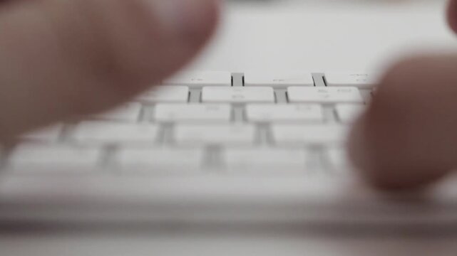 Close-Up of Hands Typing on Laptop Keyboard Remote Work, Coding, Office Productivity