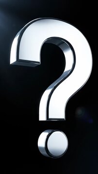 This features a large, shiny silver question mark standing out against a dark background. A spotlight shines on the question mark, highlighting its sleek, metallic surface and creating a dramatic