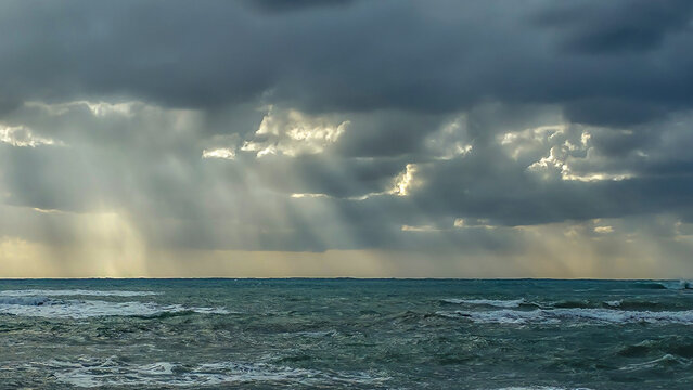 Stormy Mediterranean Sea in Paphos, Cyprus. Beach during a stormy weather. Cyclone clouds on dramatic sky
