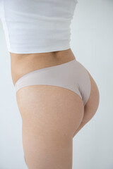 Fototapeta premium Close-up of beige underwear on a woman