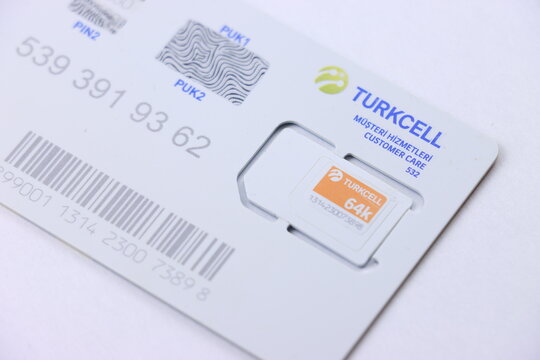 Plastic sim card frame with removable mobile chip. Telecommunication identification identity card with printed pin and puk codes for cellular network access. Equipment for mobile phone user.