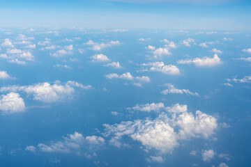 Obraz premium Blue Sky with White Clouds, Flying above Sunny Cloudy Sky Texture Pattern Plane View