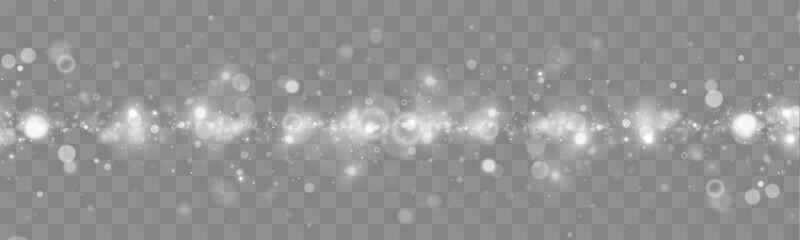 Falling white glitter sparkles drift softly on a dark transparent background. Tiny particles shimmer like magical lights. Perfect overlay for Christmas, New Year, and holiday designs. © goldstock