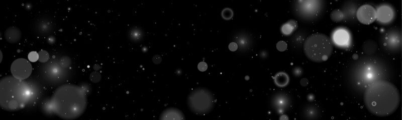 Falling white glitter sparkles drift softly on a dark transparent background. Tiny particles shimmer like magical lights. Perfect overlay for Christmas, New Year, and holiday designs. © goldstock