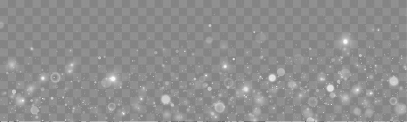 Shimmering silver dust sparkles drift softly across a dark transparent background. Tiny particles shimmer like magical stars. Perfect overlay for festive and holiday designs. © goldstock