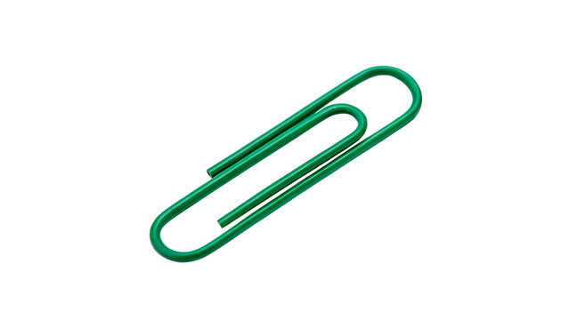 Green paper clip rests on a plain white surface with no other objects around it and minimal distraction present in the setting