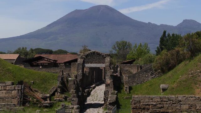 Ruins of ancient Pompeii with Mount Vesuvius volcano in the background, Italy