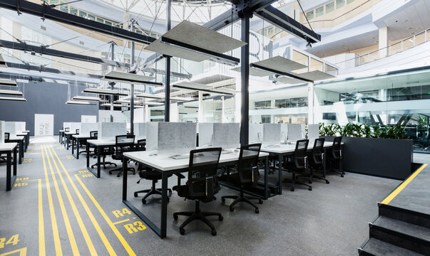 Business crisis. Big rental office with wrapped computers, no workers, row lines, copy space