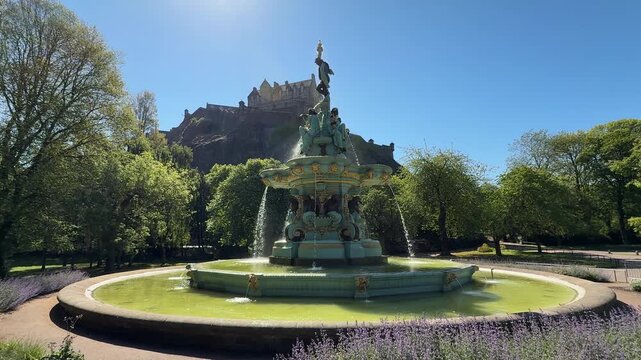 Ross Fountain and Edinburgh Castle in Princes Street Gardens, Edinburgh, UK