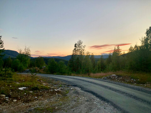 Scenic mountain gravel road at sunset in Nesbyen, Hallingdal, Norway