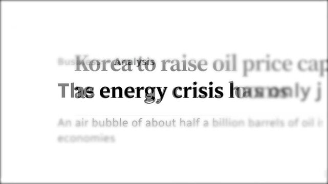 Fast camera movement over newspaper articles and headlines focusing on the global energy crisis, electricity prices, and economic instability in European countries