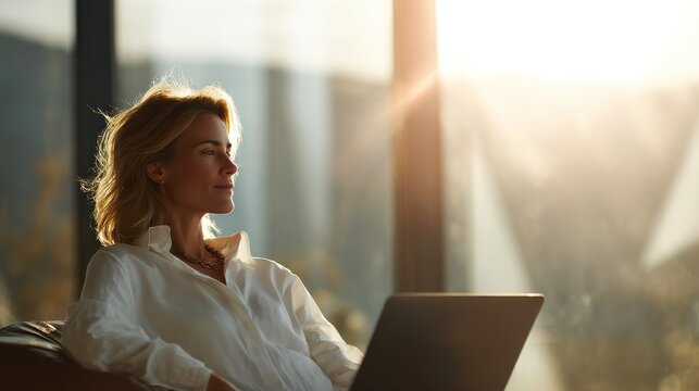 executive woman remote working with blured businessbackground and natural sunlight