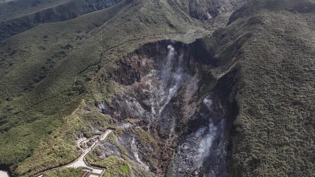 Aerial view of smoking fumaroles in volcanic crater