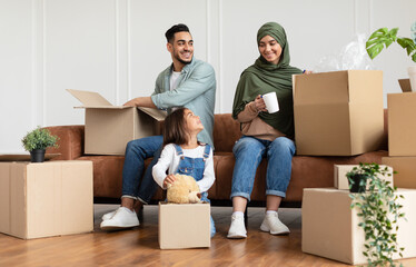 House Move And Relocation Concept. Portrait Of Cheerful Family Housing, Parent And Happy Smiling...