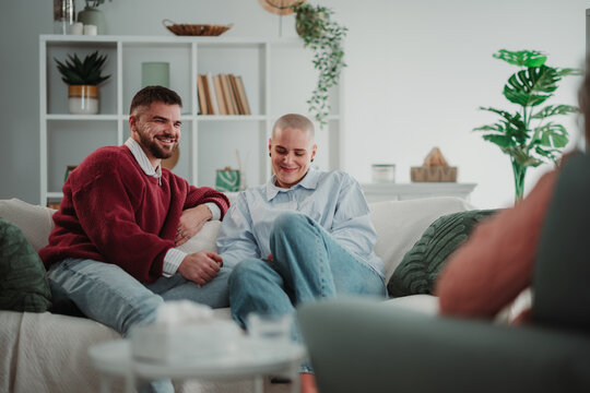 Couple smiling during mental health counseling session