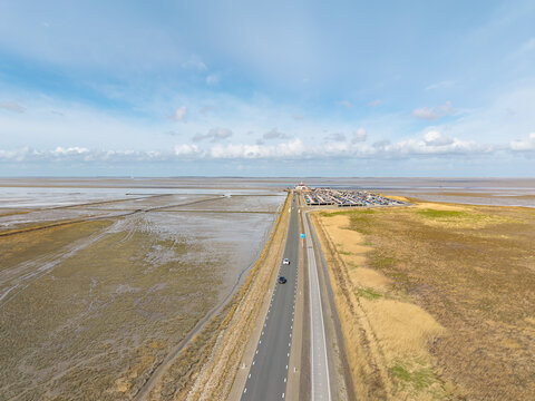 Road to Holwerd ferry across Wadden Sea aerial Netherlands