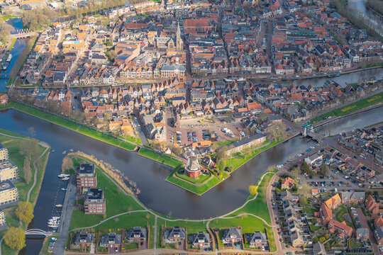 Aerial view of Dokkum fortified town with canals and windmill