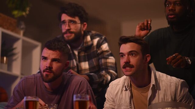 Disappointed sports fans watching a game on tv showing sad emotions and frustration after their team's failure