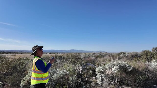  A Man Flying his UAV to survey the local earthquake faults looking at the San Andreas Fault Area near the Seven Oaks Dam 