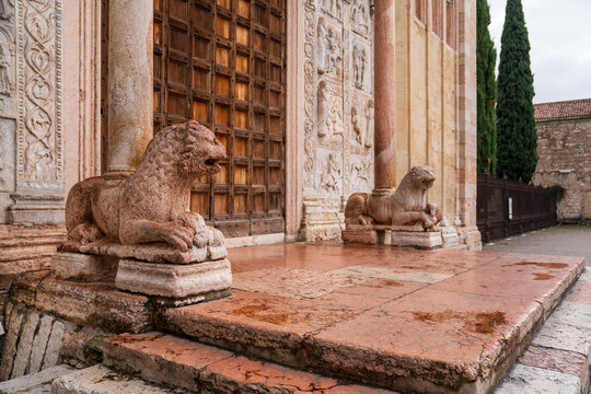 Red marble stylophore lions of the porch at the Basilica of San Zeno, Verona.