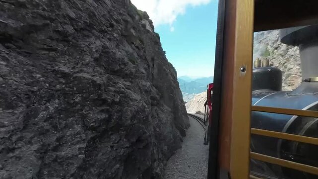 Historic steam locomotive window view of Wolfgangsee lake Austrian Alps tourism.