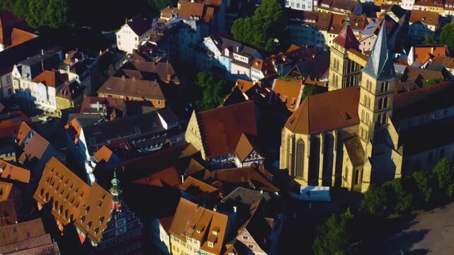 An panoramic aerial view around the old town in the city Esslingen on a sunny summer afternoon in Germany .