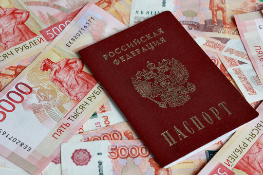 Russian passport on 5000 ruble banknotes close up