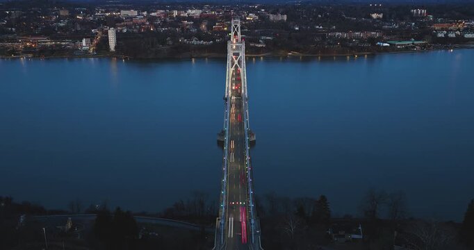 Poughkeepsie, NY, Early spring night arial timelapse video of the Franklin D. Roosevelt Mid-Hudson Bridge looking toward Poughkeepsie. 