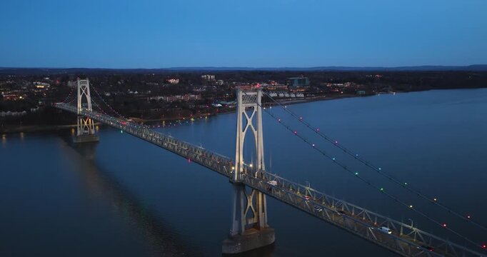 Poughkeepsie, NY, Early spring night arial video of the Franklin D. Roosevelt Mid-Hudson Bridge looking toward Poughkeepsie. 