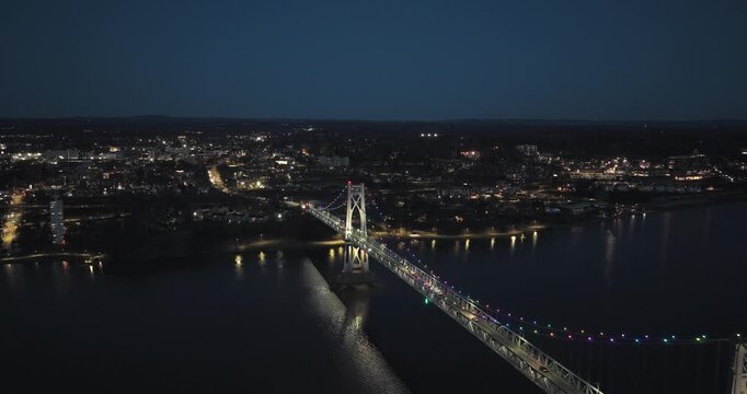 Poughkeepsie, NY, Early spring night arial video of the Franklin D. Roosevelt Mid-Hudson Bridge looking toward Poughkeepsie. 