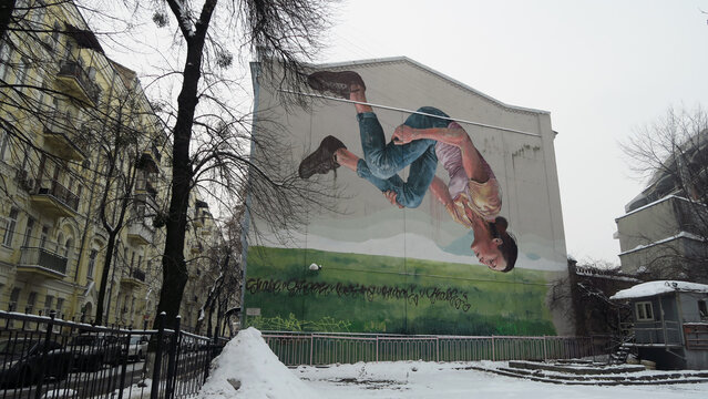 Kyiv, Ukraine. Upside Down Girl (Gymnast) by Fintan Magee.This mural is the portrait of Ukrainian gymnast Hanna Rizatdinova.