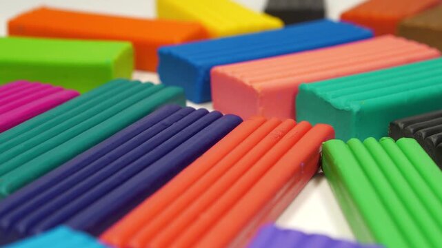 Soft clay blocks for fun and skillful modeling. Bright plasticine ready for shaping and modeling fun. Colorful plasticine pieces ready for creative play