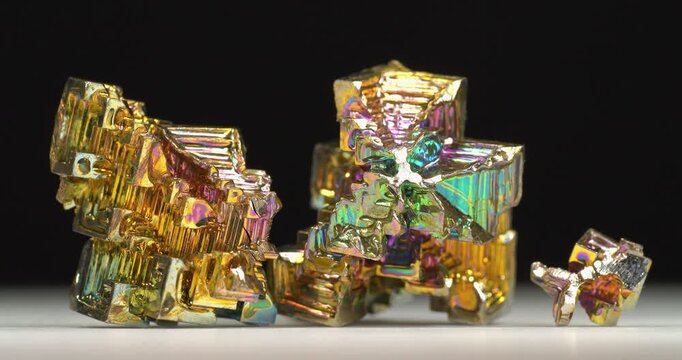 Bismuth crystals. Bismuth - chemical element with symbol Bi and atomic number 83. Post-transition metal and one of pnictogens. Synthesized bismuth crystal. Iridescent coloration is due to oxide film