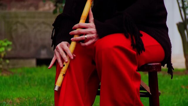 Close Up of Female Hands Playing Traditional Turkish Ney Flute