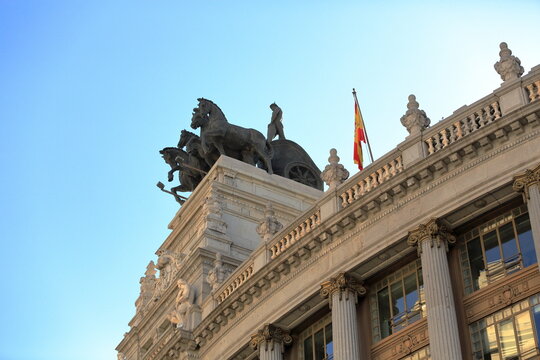 Quadriga Sculpture and Spanish Flag on Historic Madrid Building