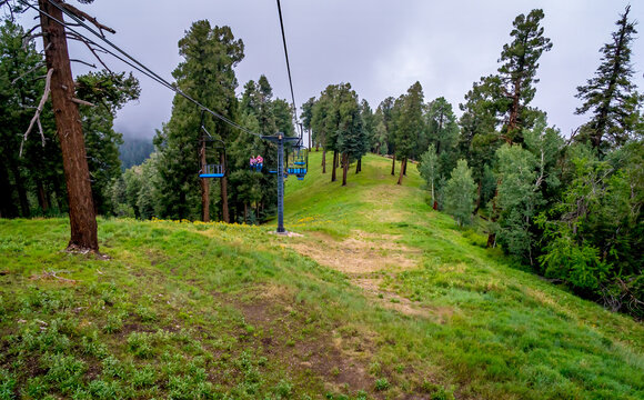 Ski lift in the clouds and fog on a summer day in the Santa Catalina Mountains near Tucson Arizona