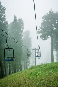 Ski lift in the clouds and fog on a summer day in the Santa Catalina Mountains near Tucson Arizona