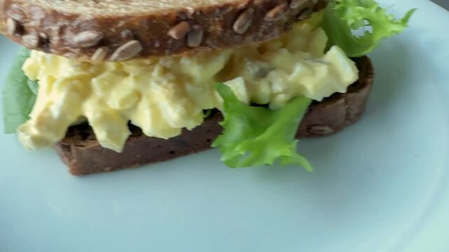 Serving an Egg Salad Sandwich with Wheat Bread